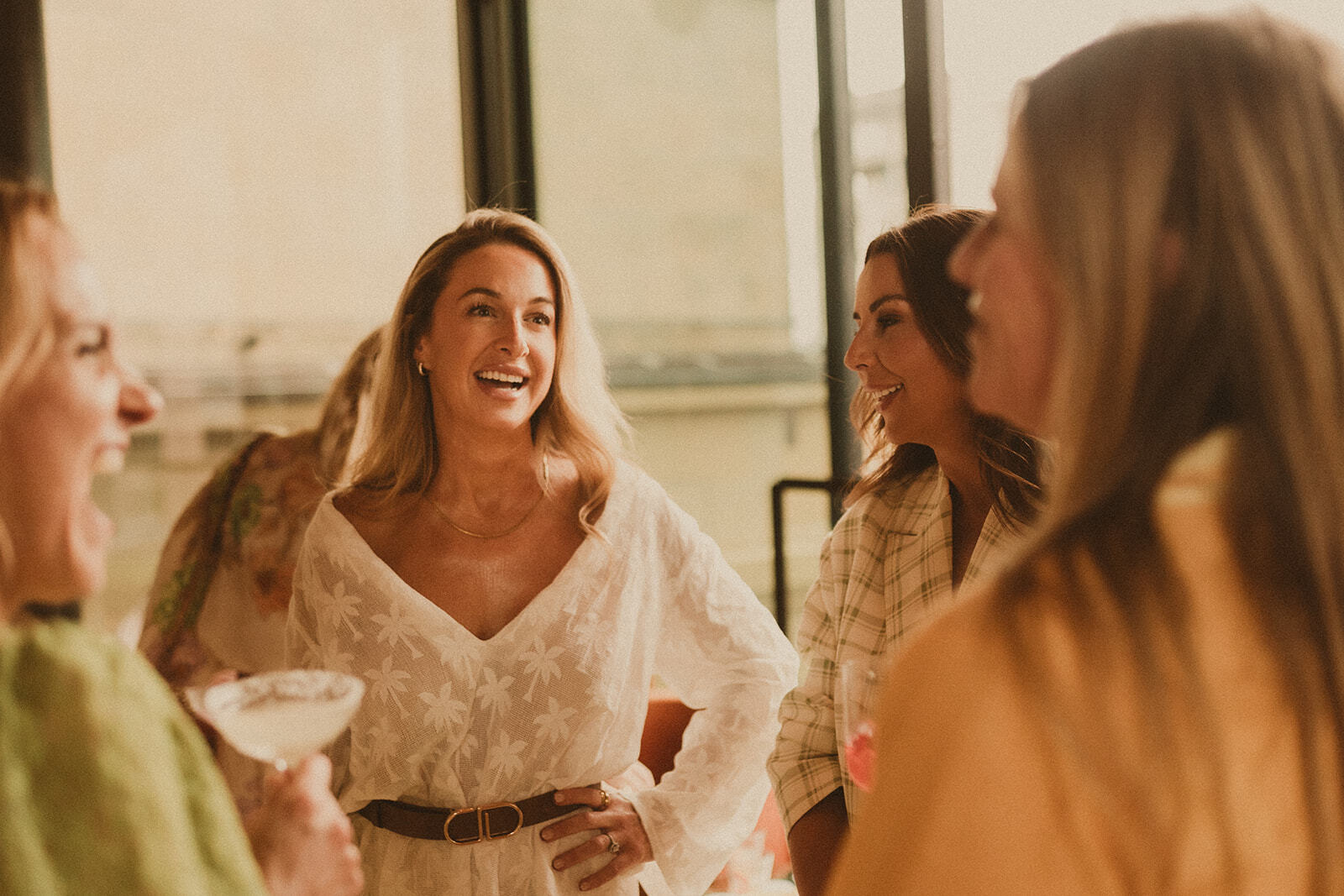 Guests at Sky Bar Sydney wearing Bohemian Traders Resort ’25 Golden Hour Club.